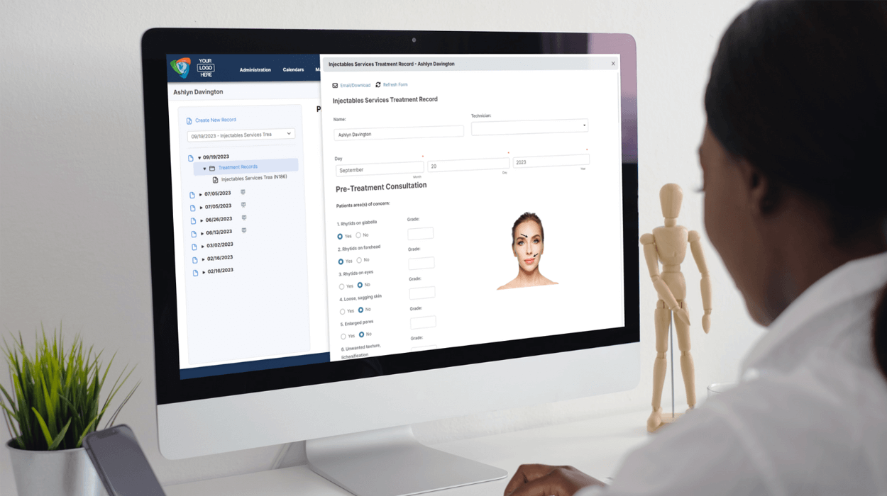 Medspa professional typing on computer