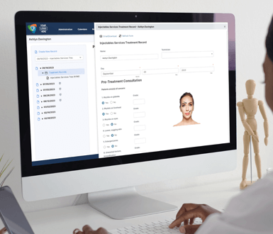 Medspa professional typing on computer