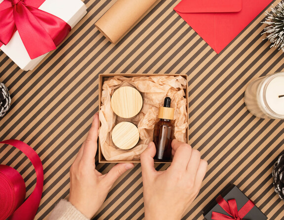 Woman receives aesthetic procedure while lying by holiday wreath