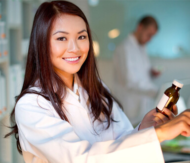 A pharmacist on a computer