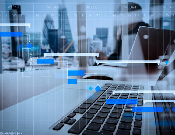Graphs overlaying a keyboard with a city background