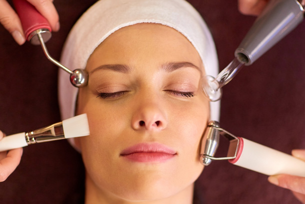 Client with multiple devices showing a combination of different treatments that can be managed through spa management software.
