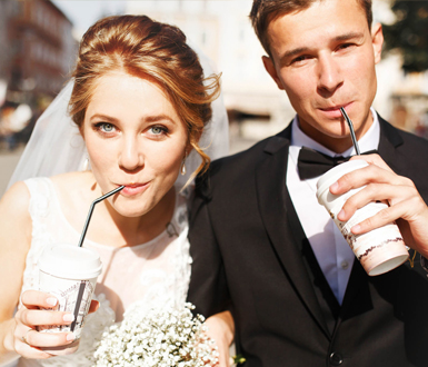 Groom and his bride confidently being photographed on their wedding day after receiving medspa treatments.
