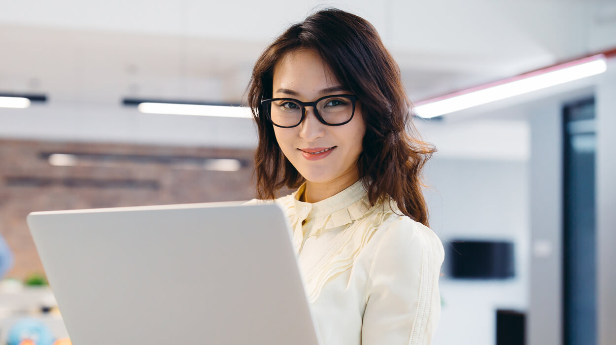 Medspa professional with a laptop