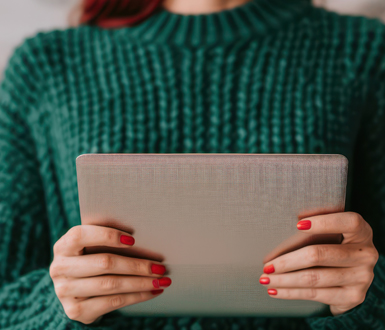 Medspa professional setting up a holiday email marketing campaign.