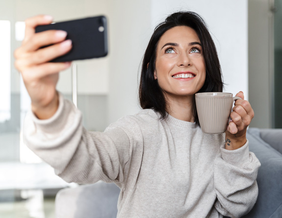 Influencer recording a social media follow-up post about her visit to a medspa.
