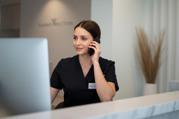 Medspa employee booking a client who discovered their business through local SEO using the best medical spa software.
