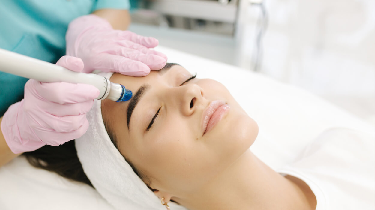 A medspa client receiving microdermabrasion.