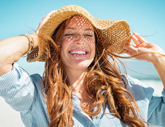 Medspa client protecting her skin from UV exposure.