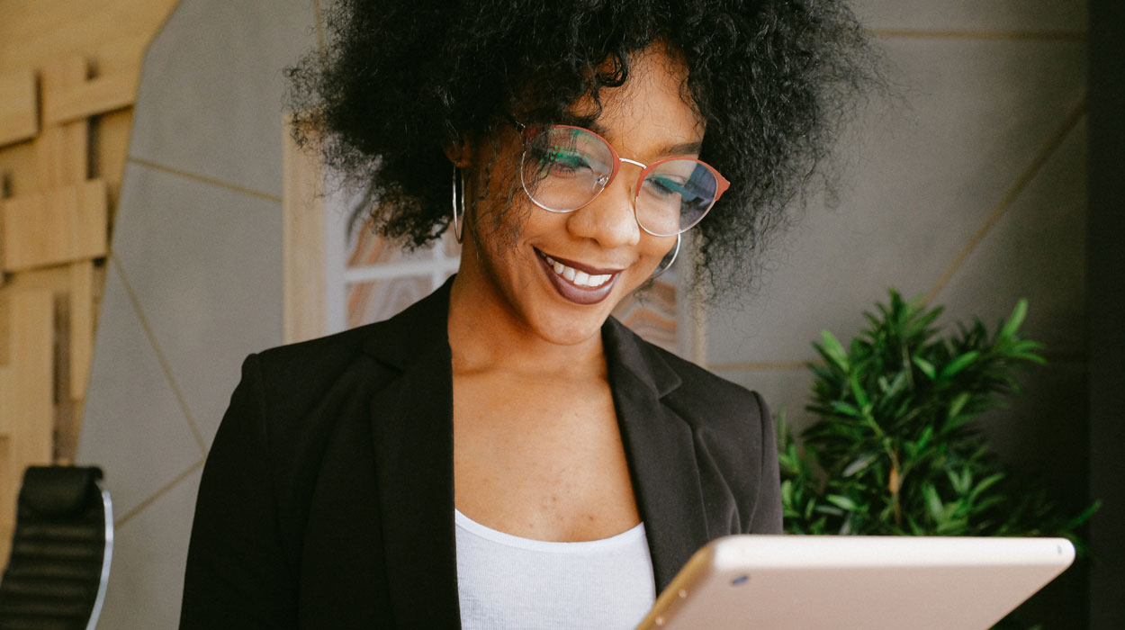 Spa owner using spa management software to book appointments.