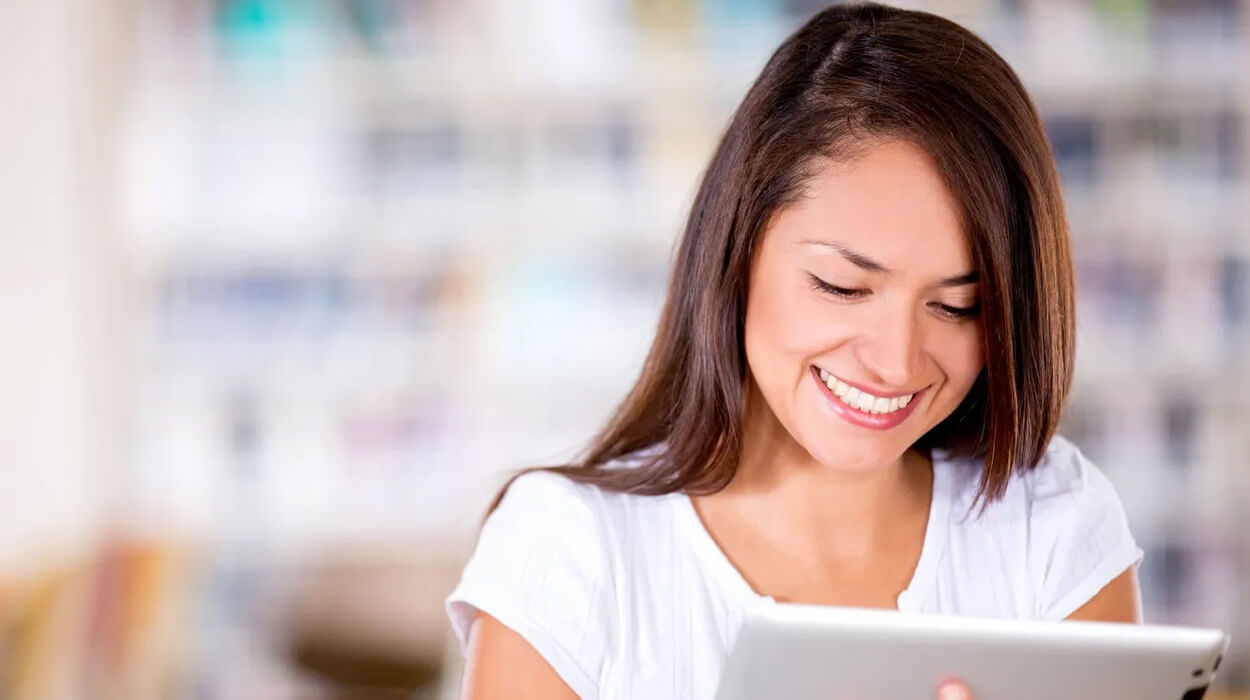 Spa employee reading on a tablet