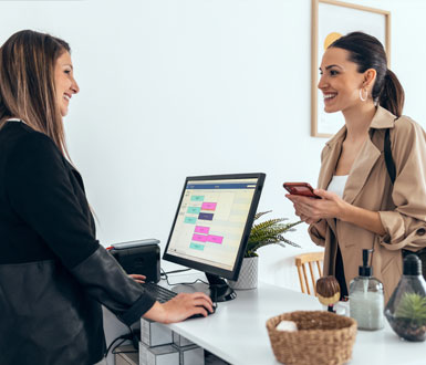 Spa owner manages client memberships using spa software.