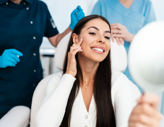 A physician is reviewing treatment history using spa management software with their client.
