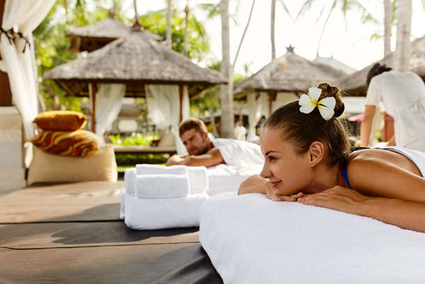 Couple having relaxing concierge massage service booked through aesthetic clinic software