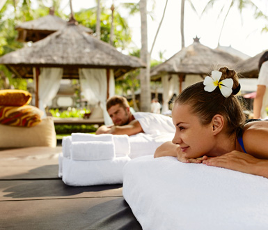 Couple having relaxing concierge massage service booked through aesthetic clinic software