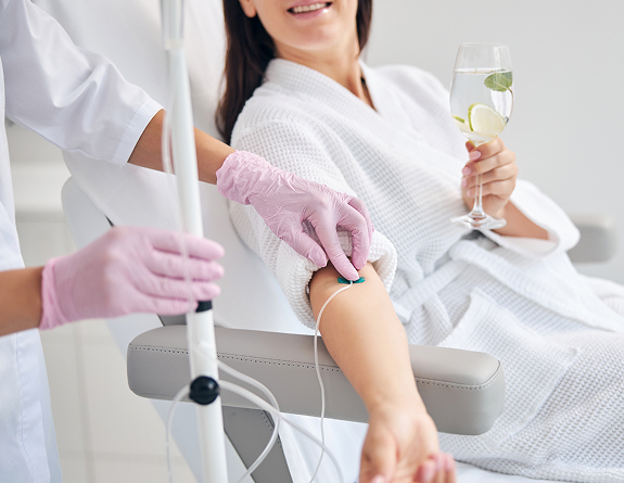 Client getting IV hydration service booked through the best medical spa software