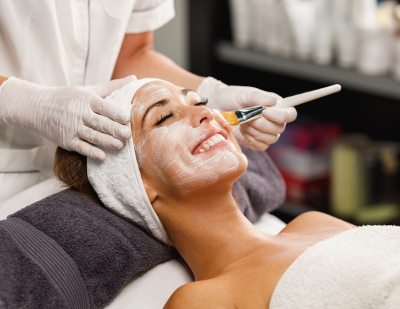 Client getting a facial booked through medical spa booking software