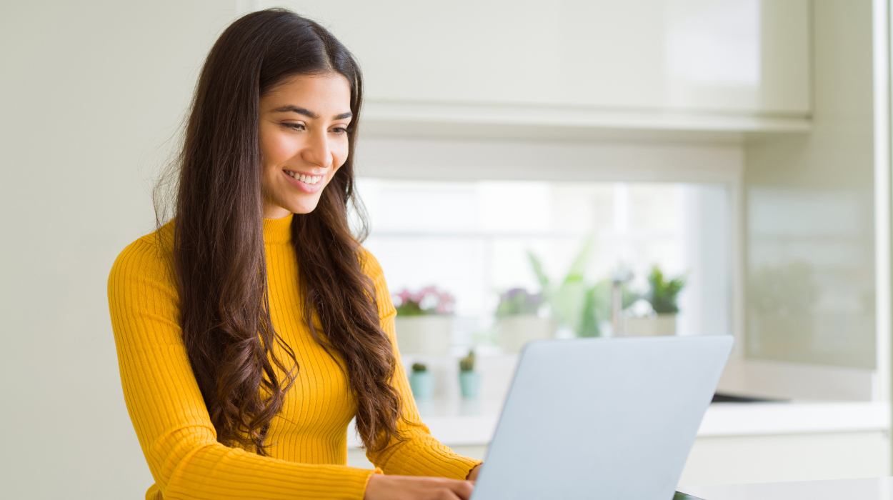 Med spa owner reviewing lead generation strategies on computer using medical spa software dashboard