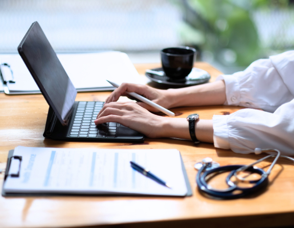 Medspa owner notating services performed using best medical spa software