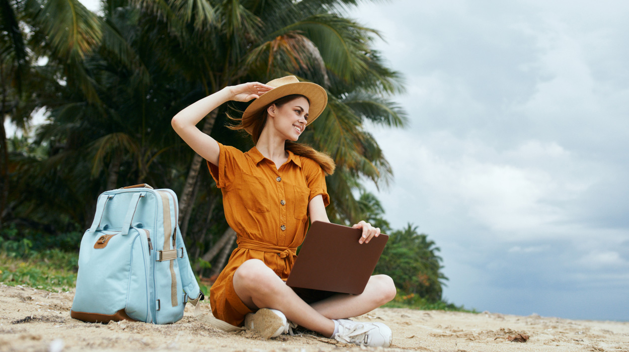 Medspa owner working remote from the beach using EMR for medspa.