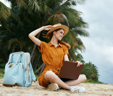 Medspa owner working remote from the beach using EMR for medspa.