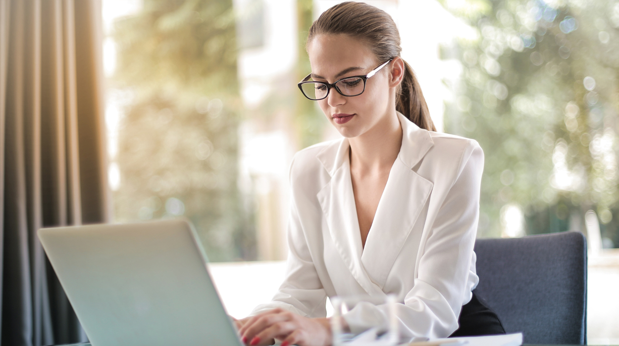 Medspa owner using spa management software to review profit reporting