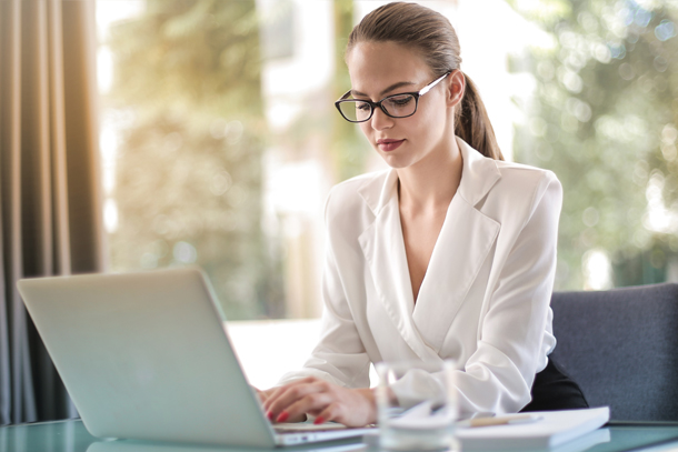 Medspa owner using spa management software to review profit reporting