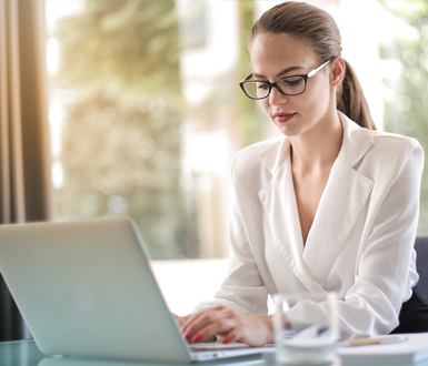 Medspa owner using spa management software to review profit reporting