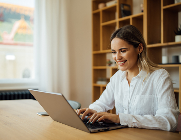 Medspa business owner using aesthetic clinic software for reporting
