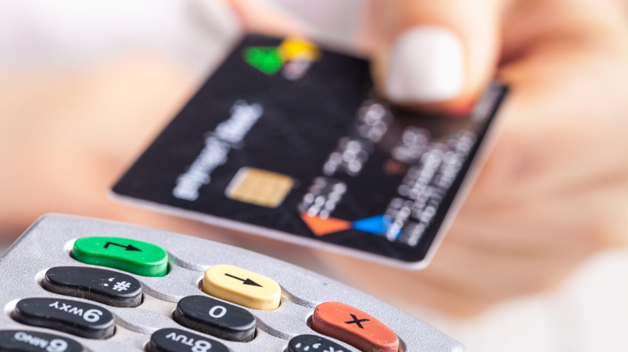Person paying with a credit card after a medical spa treatment.