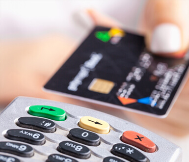 Person paying with a credit card after a medical spa treatment.