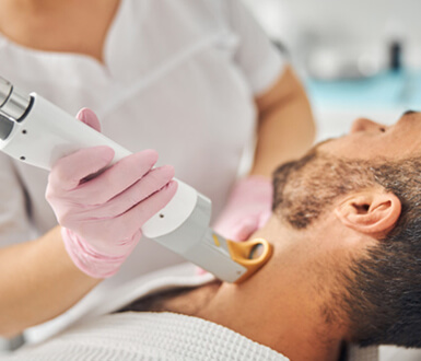 Male receiving laser hair removal service at his medi spa.