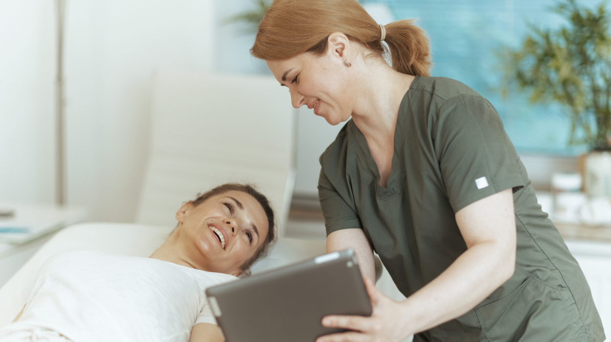 Massage therapist using medical spa software to schedule their next appointment.