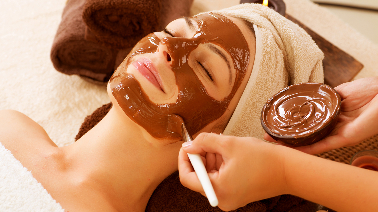 Client receiving facial booked through spa management software