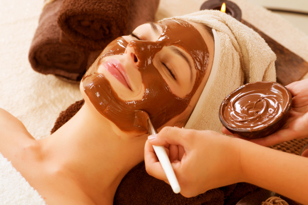 Client receiving facial booked through spa management software