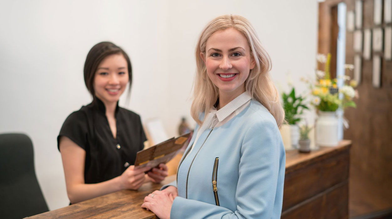Medspa Customer Smiling at the Counter