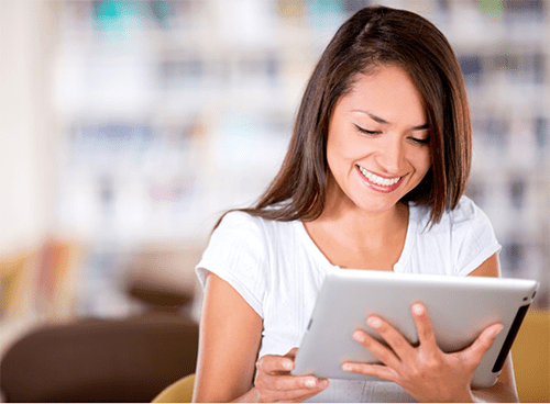 Spa employee reading on a tablet