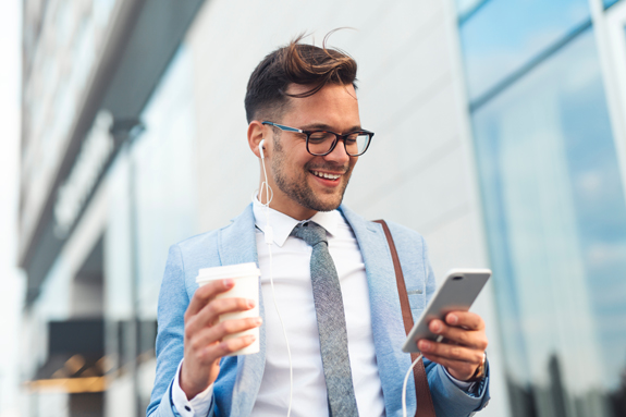 Male client checks out customer testimonials for the aesthetic office he is visiting.