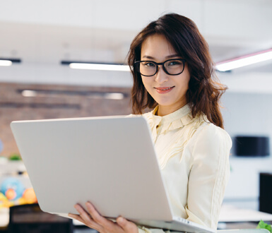 Medspa professional with a laptop