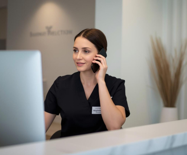 Medspa employee booking a client who discovered their business through local SEO using the best medical spa software.