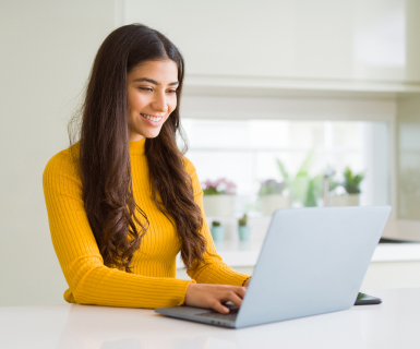 Med spa owner reviewing lead generation strategies on computer using medical spa software dashboard