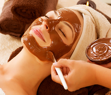 Client receiving facial booked through spa management software